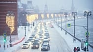 Cars drive along the Kremlin Wall during heavy snowfall in Moscow, 29 January, 2026