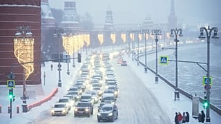 Cars drive along the Kremlin Wall during heavy snowfall in Moscow, 29 January, 2026