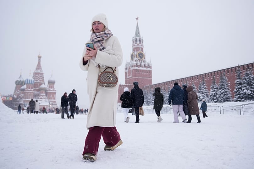 People walk along Red Square during heavy snowfall in Moscow, 29 January, 2026