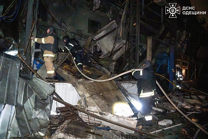 Emergency services personnel work to extinguish a fire following a Russian attack in Odesa region, 29 January, 2026