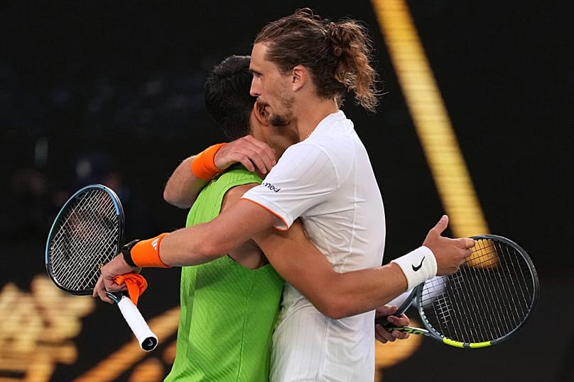 Carlos Alcaraz of Spain is congratulated by Alexander Zverev of Germany following their semifinal match at the Australian Open in Melbourne, Australia, Friday, Jan. 30, 2026