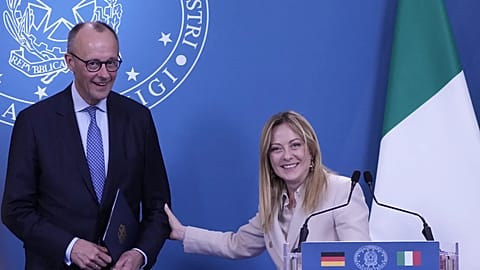 Italian Premier Giorgia Meloni, right, and German Chancellor Friedrich Merz, left, attend a press conference at the end of an intergovernmental summit at Villa Doria Pamphilj 