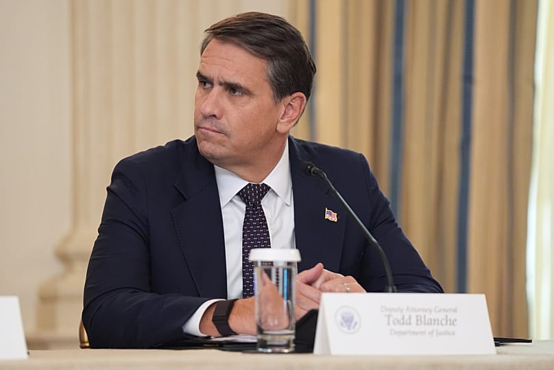 US Deputy Attorney General Todd Blanche listens to President Donald Trump speak in the State Dining Room at the White House, 8 October, 2025