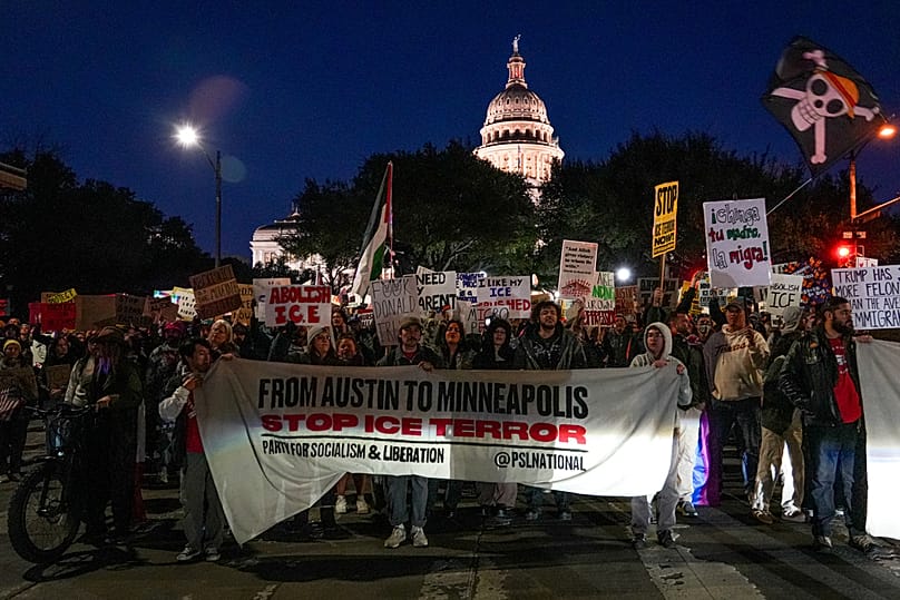 Protesters march on Congress avenue as part of nationwide protest against actions by U.S. Immigrations and Customs Enforcement Friday, Jan 30, 2026, in Austin, Texas.