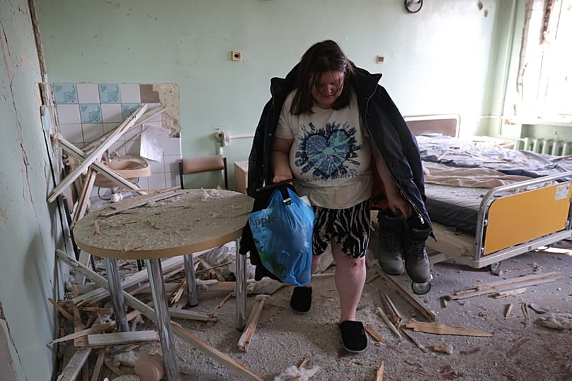 A pregnant patient evacuates from the hospital room after a Russian drone hit a city maternity hospital in Zaporizhzhia, Ukraine, Sunday, Feb. 1, 2026. (AP Photo/Kateryna Kloc
