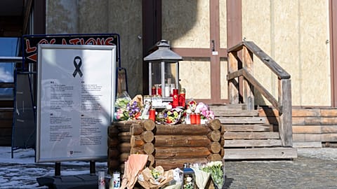 Flowers for the victims left infront of the bar in Crans Montana
