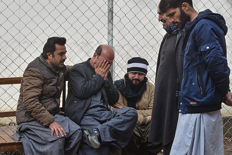 Relatives of police officers who were killed in a militants attack, mourn outside a hospital in Quetta, Pakistan, Saturday, Jan. 31, 2026