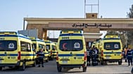 Ambulances line up to enter the Egyptian gate of the Rafah crossing on the way to the Gaza Strip, in Rafah, Egypt, Sunday, Feb. 1, 2026