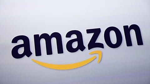 FILE - The Amazon logo is displayed at a news conference in New York on Sept. 28, 2011