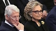 FILE - Former President Bill Clinton and former Secretary of State Hillary Clinton listen during a state funeral for former President Jimmy Carter, in Washington, Jan. 9, 2025
