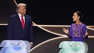 Mexican President Claudia Sheinbaum speaks as President Donald Trump stands on stage during the draw for the 2026 World Cup at the Kennedy Center in Washington, Dec. 5, 2025