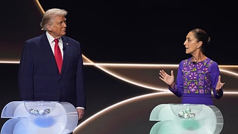 Mexican President Claudia Sheinbaum speaks as President Donald Trump stands on stage during the draw for the 2026 World Cup at the Kennedy Center in Washington, Dec. 5, 2025