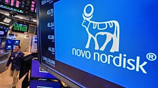 FILE - The logo for Danish drugmaker Novo Nordisk is displayed above a trading post on the floor of the New York Stock Exchange. 24 November 2025. 