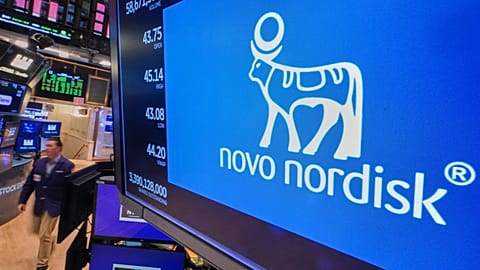 FILE - The logo for Danish drugmaker Novo Nordisk is displayed above a trading post on the floor of the New York Stock Exchange. 24 November 2025. 