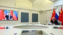 Videokonferenz zwischen Wladimir Putin und Xi Jinping