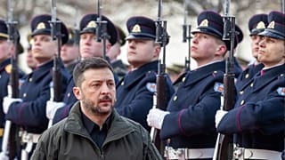 FILE: Ukrainian President Volodymyr Zelenskyy reviews a guard of honour during a welcome ceremony at the Presidential Palace, in Vilnius, 25 January 2026
