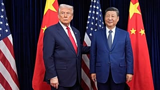 FILE - President Donald Trump, left, and Chinese President Xi Jinping pose ahead of their summit talk at Gimhae International Airport in Busan, South Korea, Oct. 30, 2025