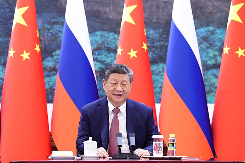 Chinese President Xi Jinping holds a virtual meeting with Russian President Vladimir Putin, unseen, at the Great Hall of the People in Beijing on Wednesday, Feb. 4, 2026