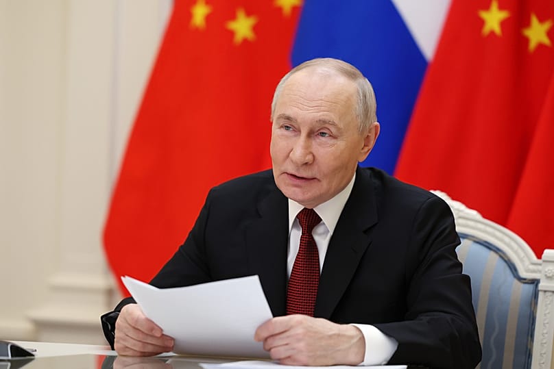 Russian President Vladimir Putin speaks with Chinese President Xi Jinping via videoconference at the Kremlin in Moscow, Wednesday, Feb. 4, 2026