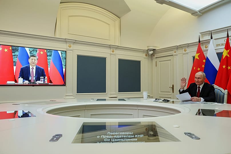 Russian President Vladimir Putin speaks with Chinese President Xi Jinping via videoconference at the Kremlin in Moscow, Wednesday, Feb. 4, 2026