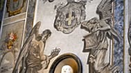 A detail of a fresco inside the Basilica of San Lorenzo in Lucina, in Rome, shows a cherub, right, bearing a striking resemblance to Premier Giorgia Meloni, Sunday, Feb. 1