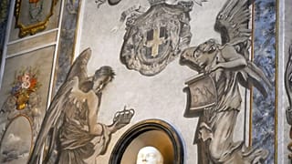 A detail of a fresco inside the Basilica of San Lorenzo in Lucina, in Rome, shows a cherub, right, bearing a striking resemblance to Premier Giorgia Meloni, Sunday, Feb. 1