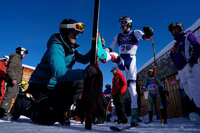 Czech Republic's Jan Zabystran has his ski polished ahead of an alpine ski, men's downhill official training, at the 2026 Winter Olympics, in Bormio,  5 February 2026