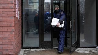 An investigator leaves an apartment building where deputy chief of Russian military intelligence Lt Gen Vladimir Alekseyev was shot and wounded, in Moscow, 6 February 2026