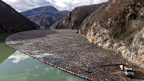 An aerial view shows tons of waste filling the Drina river in Visegrad, Bosnia, Thursday, Feb. 5, 2026. 