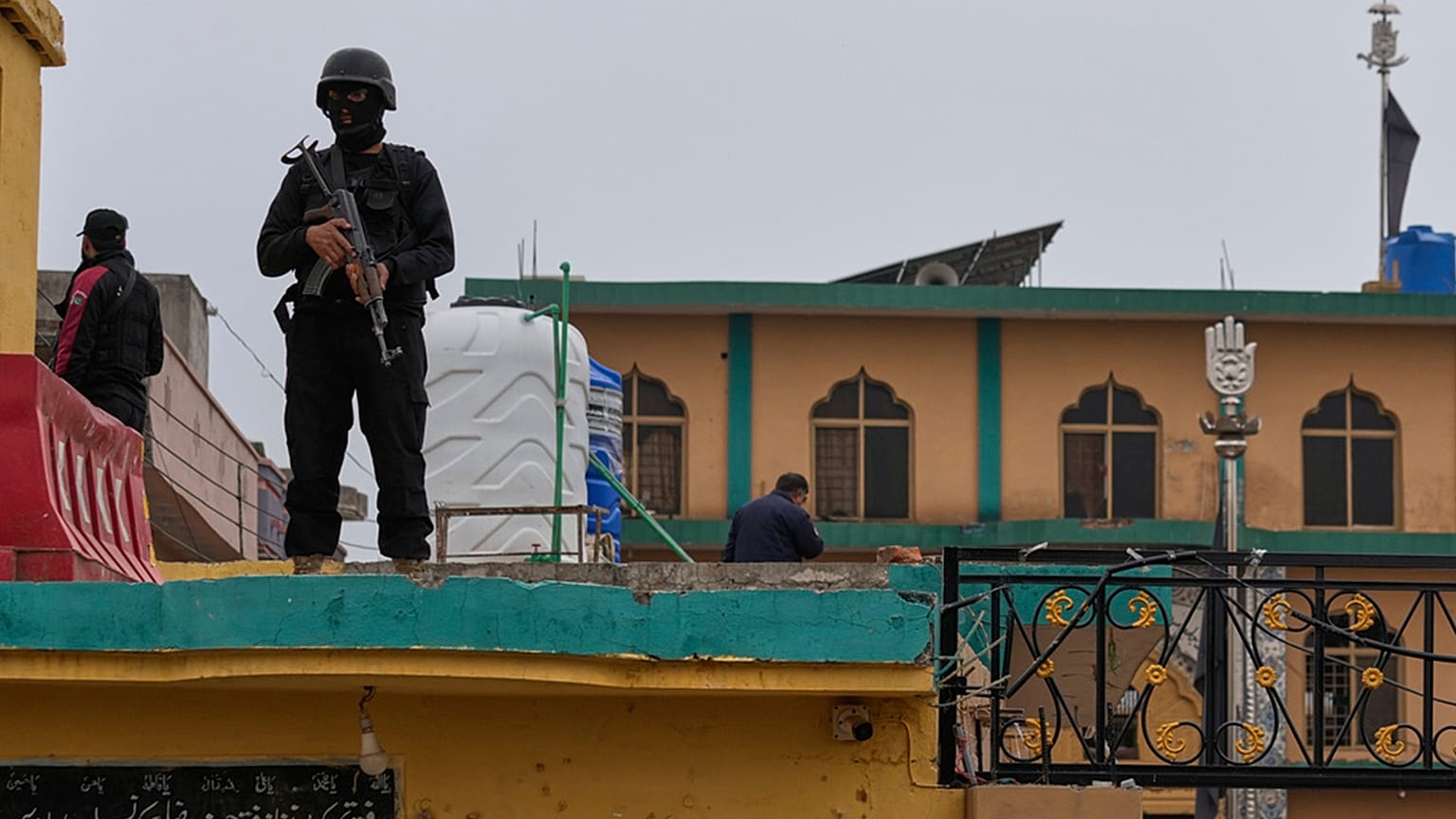 Police commandos take positions at the site of a bomb explosion at a Shiite mosque, in Islamabad, 6 February 2026