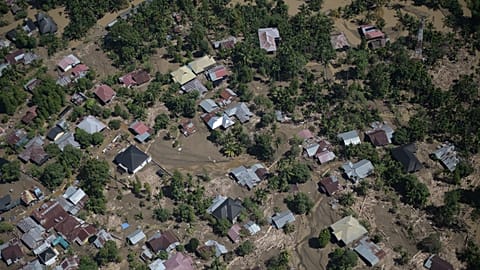 This photo taken from a national disaster mitigation agency's helicopter during an aerial aid distribution shows an area affected by floods in the aftermath of Cyclone Senyar.