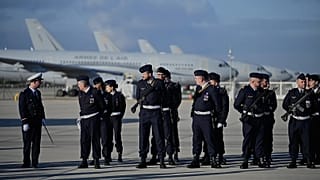 Soldiers prepare for the arrival of French President Emmanuel Macron at the Istres military air base in the south of France on 15 January 2026.