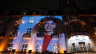 A picture of peace prize winner Narges Mohammadi is projected on the wall of the Grand Hotel in central Oslo
