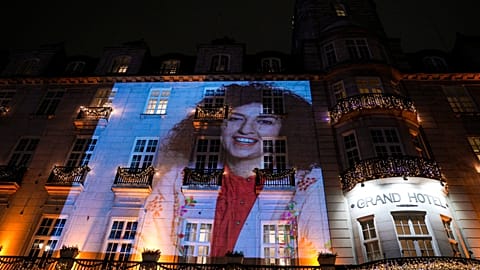 A picture of peace prize winner Narges Mohammadi is projected on the wall of the Grand Hotel in central Oslo