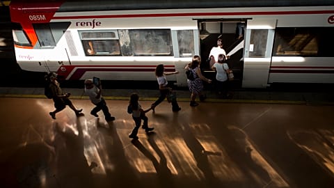 People run to catch a train during a 24-hour partial strike by train drivers at Atocha station in Madrid, 10 June 2016.