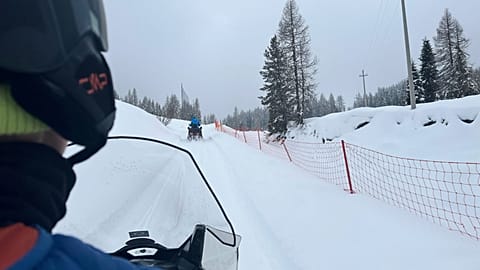 AP video journalist Brittany Peterson drives a snowmobile during a tour to the Three Peaks of Lavaredo, Thursday, Feb. 5, 2026.