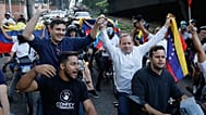 Opposition leader Juan Pablo Guanipa and political activist Jesus Armas ride on the back of motorbikes after their release from prison in Caracas, 8 February 2026