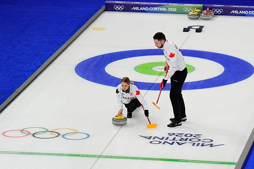 Jocelyn Peterman and Brett Gallant, of Canada, compete during a curling mixed doubles round robin session at the 2026 Winter Olympics, in Cortina, 6 February 2026