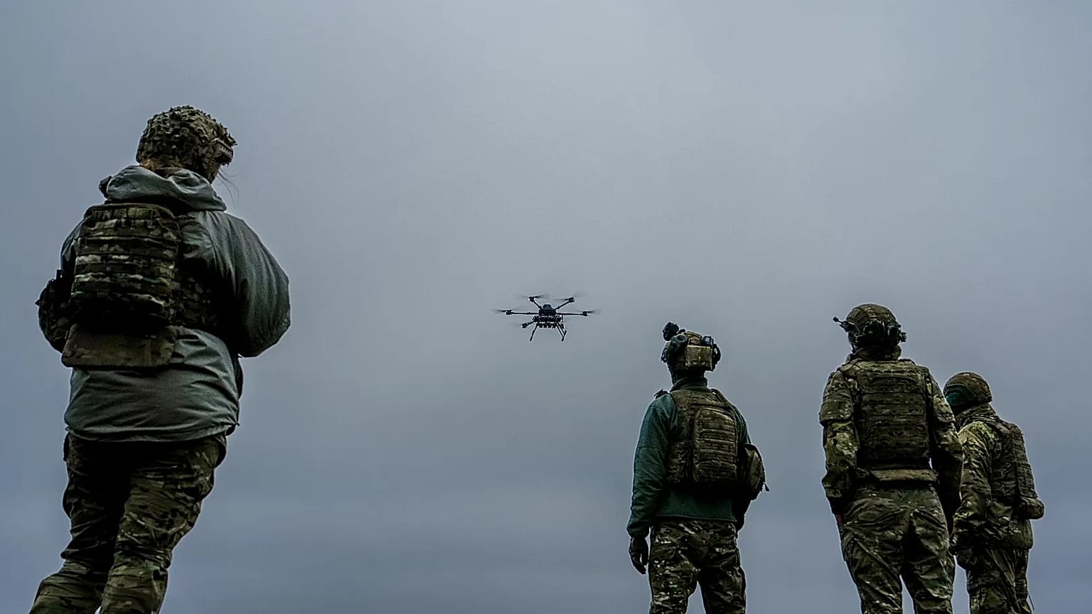 A Ukrainian drone operator from the Kraken 1654 unit, callsign Imla, left, flies a Vampire drone as other soldiers watch, Nov. 5, 2025, in Kharkiv region, Ukraine. 