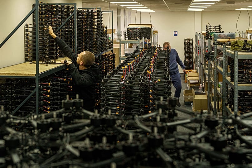 An engineer collects FPV drones of "General Cherry" company at the workshop in Ukraine, on Dec. 4, 2025. 