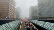 FILE: Cars drive in the fog during morning traffic congestion in Brussels, 25 January 2022