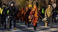 Buddhist monks who are participating in a Walk For Peace walk through a neighborhood on Tuesday, Feb. 10, 2026, in Washington.