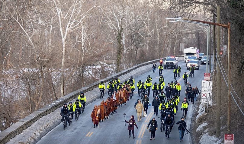 Buddhist monks who are participating in a Walk For Peace walk along the C&O Canal and Potomac River on Tuesday, Feb. 10, 2026, in Washington.