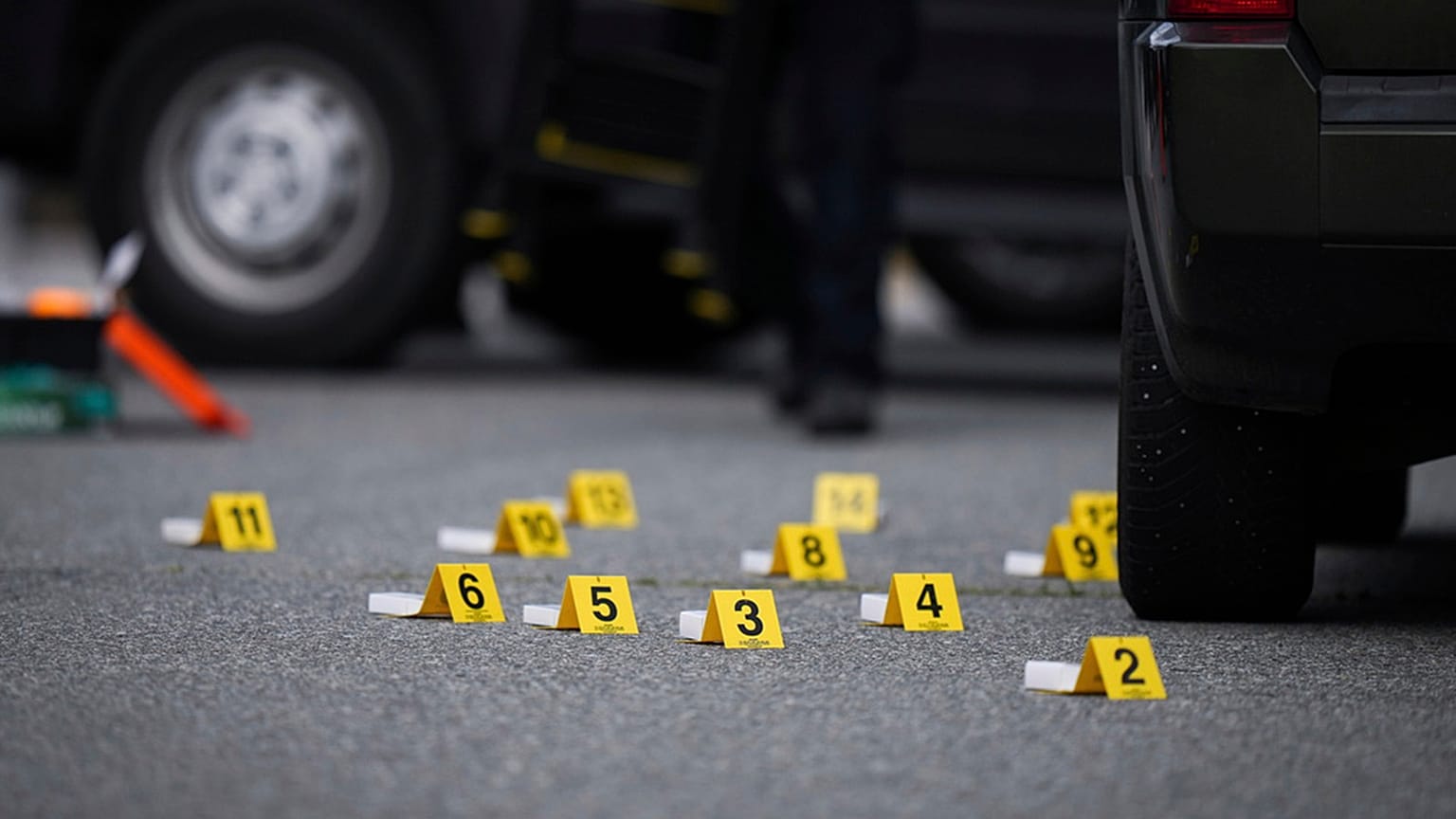 FILE: Evidence markers are placed beside shell casings on the street in Surrey, BC, Canada, 7 August 2025