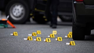 FILE: Evidence markers are placed beside shell casings on the street in Surrey, BC, Canada, 7 August 2025