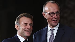 German Chancellor Friedrich Merz welcomes French President Emmanuel Macron at the Chancellery in Berlin, Germany, Monday, Dec. 15, 2025.