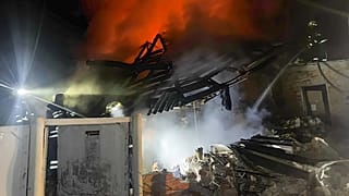Emergency services personnel work to extinguish a fire at a private house following a Russian air attack in Bohodukhiv, 11 February, 2026