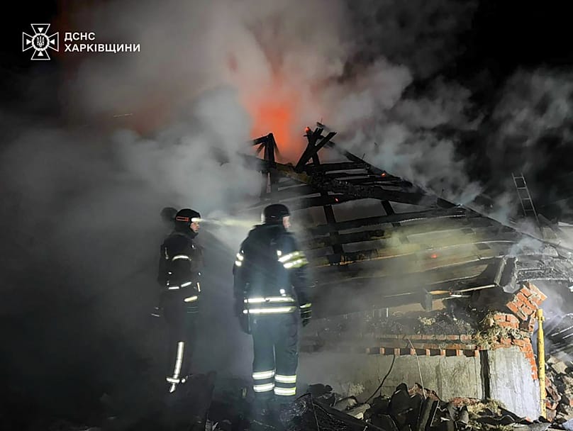 Emergency services personnel work to extinguish a fire at a private house following a Russian air attack in Bohodukhiv, 11 February, 2026
