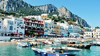 Capri receives up to 50,000 daily visitors in peak season, a number far exceeding the resident population of roughly 13,000 to 15,000.