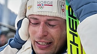 Norway’s Sturla Holm Laegreid reacts after he won bronze in the men's 20-kilometre individual biathlon race at the 2026 Winter Olympics in Anterselva, 10 February, 2026